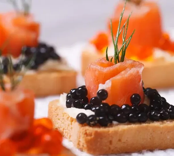 Impress your guests with our elegant caviar canapés, the perfect appetizer for any upscale gathering. Delight in the luxurious flavors and textures of these bite-sized delights.