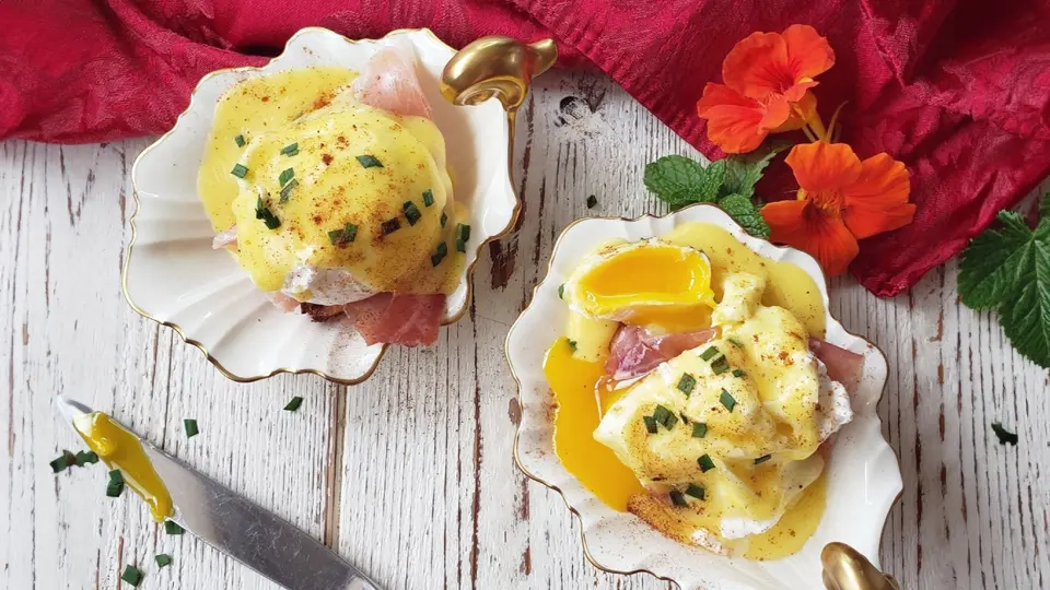 Elevate your brunch game with Eggs Benedict and Passion Fruit Hollandaise. The combination of rich poached eggs, savory ham, and tangy hollandaise sauce will delight your taste buds.