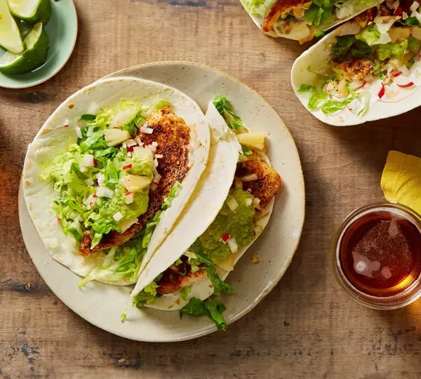 Transport your taste buds to the tropics with our flavorful fish tacos featuring pineapple salsa and avocado crema. The combination of flaky fish, sweet pineapple, and creamy avocado is a culinary adventure you won't want to miss.