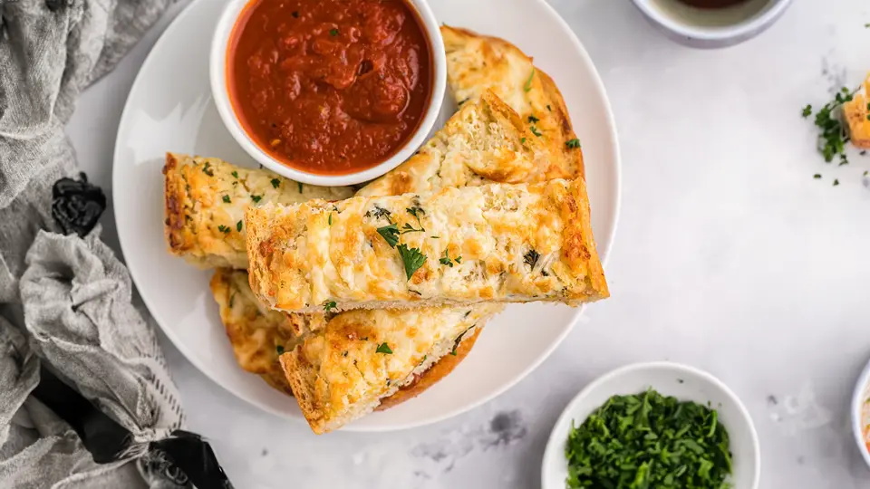 Elevate your appetizer spread with delicious garlic bread and dip. Whether you're entertaining guests or enjoying a movie night, this savory treat is sure to impress.