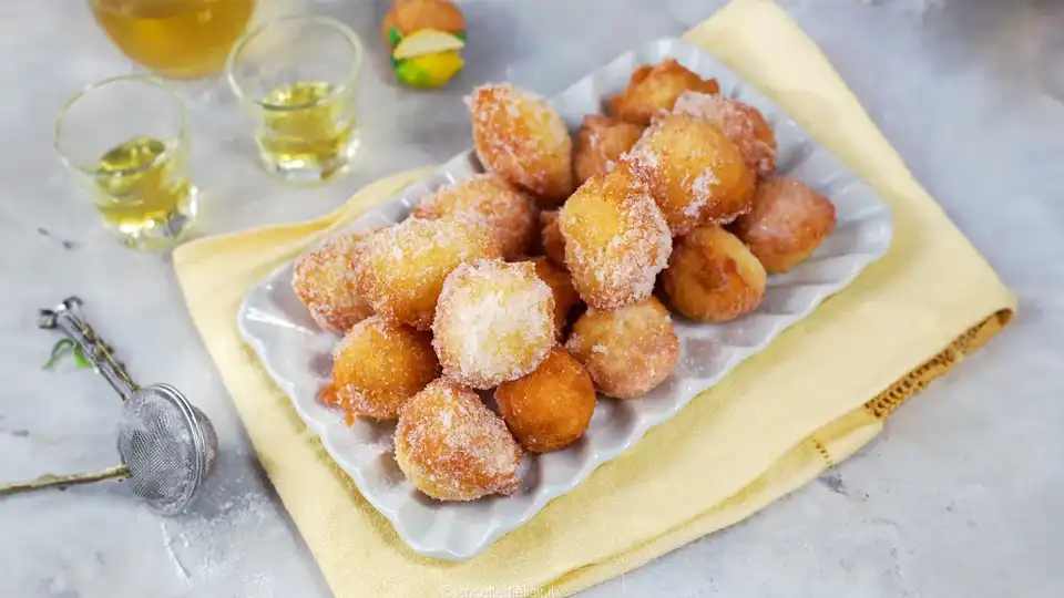 Enjoy the zesty flavor of Italy with our Limoncello Castagnole recipe. These delightful lemon-flavored doughnuts are perfect for a sweet treat or indulgent snack.