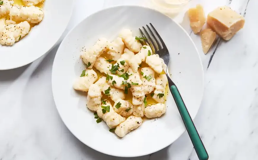 Indulge in the pillowy goodness of our Potato Gnocchi recipe. Made with fluffy potatoes and delicate flour, these homemade dumplings are perfect for a comforting meal.