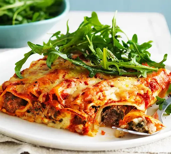 Treat yourself to the comforting flavors of our Spinach Ricotta Cannelloni recipe. A delightful blend of creamy ricotta, spinach, and marinara sauce, baked to perfection.