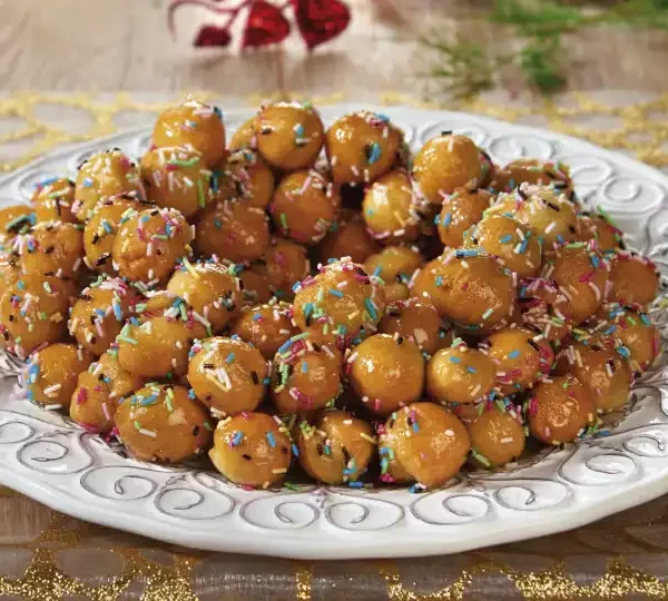 Indulge in the sweetness of our Struffoli recipe. These traditional Italian honey balls are crispy on the outside, soft on the inside, and coated in delicious honey syrup.