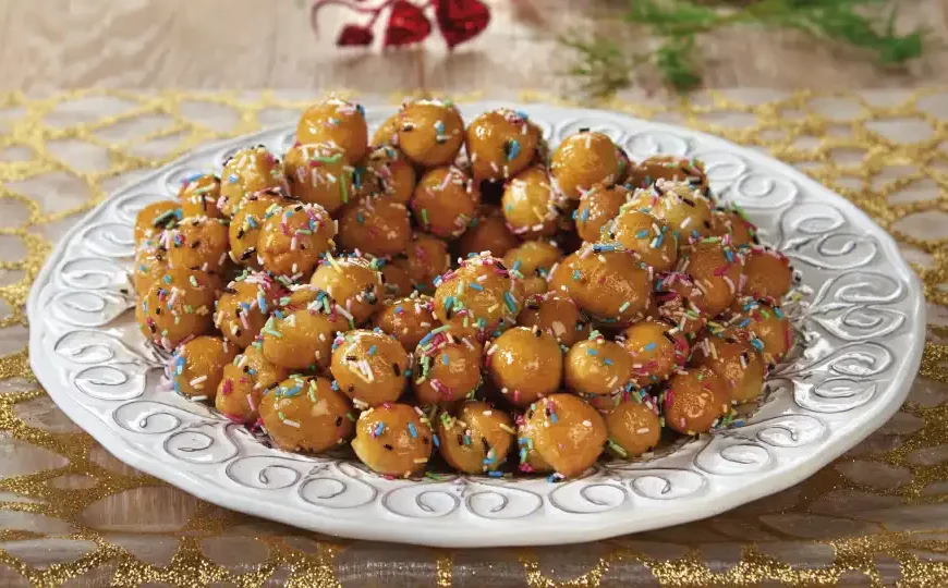 Indulge in the sweetness of our Struffoli recipe. These traditional Italian honey balls are crispy on the outside, soft on the inside, and coated in delicious honey syrup.