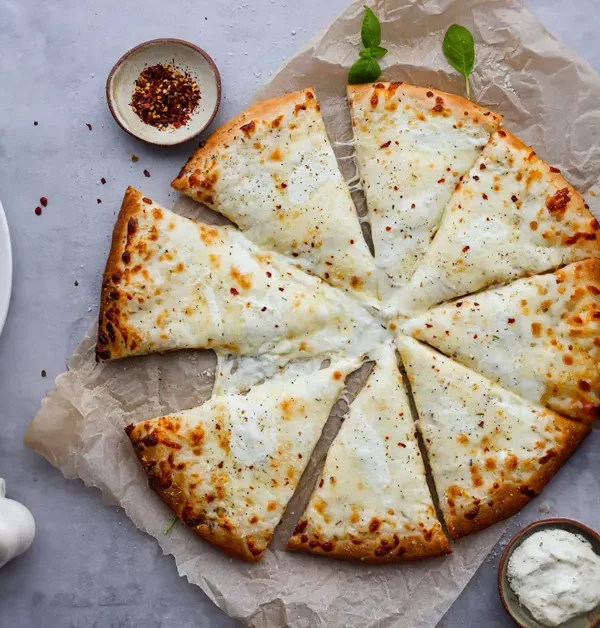 Elevate your pizza experience with our delectable White Pizza recipe. A perfect blend of creamy cheeses and savory toppings for a taste sensation like no other.